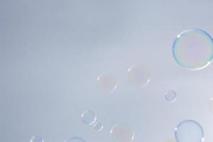 Bubbles in front of greyish-white background photo