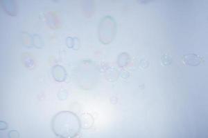 Bubbles in front of greyish-white background photo