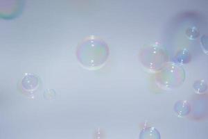 Bubbles in front of greyish-white background photo