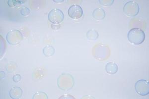 Bubbles in front of greyish-white background photo