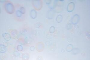 Bubbles in front of greyish-white background photo