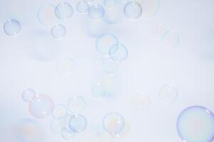 Bubbles in front of greyish-white background photo