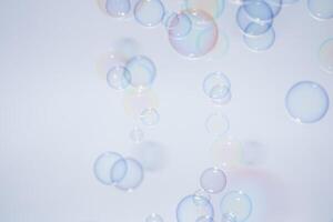 Bubbles in front of greyish-white background photo