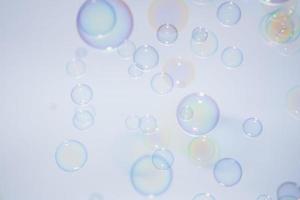 Bubbles in front of greyish-white background photo