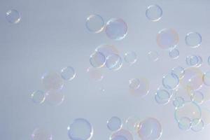 Bubbles in front of greyish-white background photo