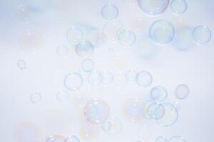 Bubbles in front of greyish-white background photo