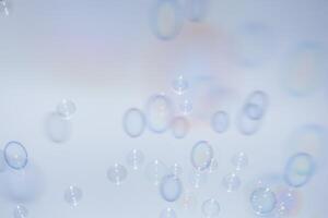 Bubbles in front of greyish-white background photo