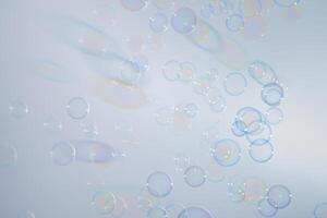 Bubbles in front of greyish-white background photo