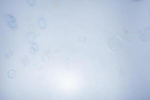 Bubbles in front of greyish-white background photo