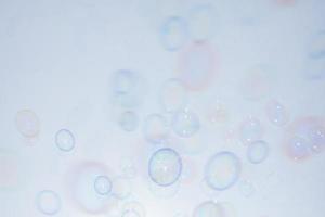 Bubbles in front of greyish-white background photo