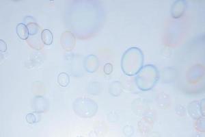 Bubbles in front of greyish-white background photo