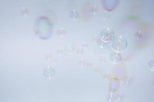 Bubbles in front of greyish-white background photo