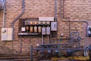 Red Brick wall with electrical system photo