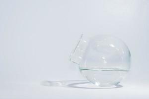 Globular jar filled with water inside photo