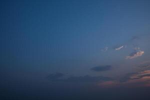 A person flying a kite in the sky photo
