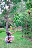 Cute little asian girl in the park photo