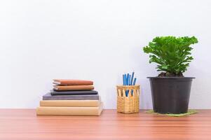 Books and stationery on the desk photo