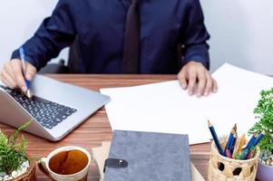 Businessman working at his desk photo