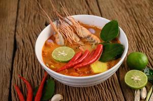 Hot and spicy tom yum kung Thai soup photo