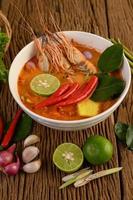 Hot and spicy tom yum kung Thai soup photo