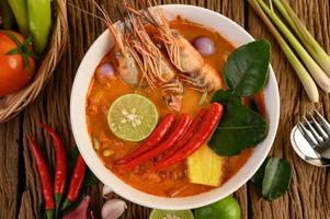 Hot and spicy tom yum kung Thai soup photo