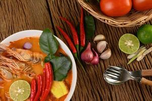 Hot and spicy tom yum kung Thai soup photo