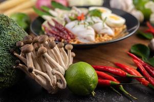 Noodles with squid and boiled egg photo