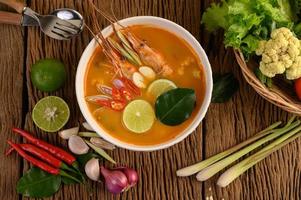 Hot and spicy tom yum kung Thai soup photo