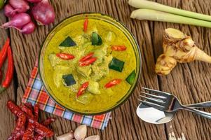 Green curry in a clear bowl photo