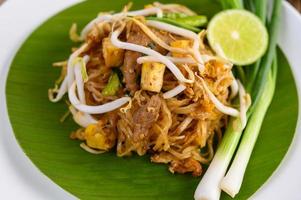 Pad Thai dish on a banana leaf photo