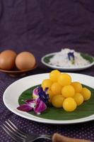 Thong Yod, Thai dessert on a banana leaf photo