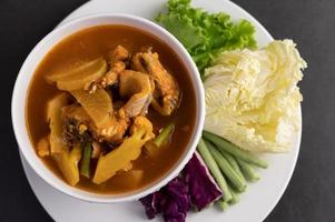 Yellow curry with snakehead fish photo