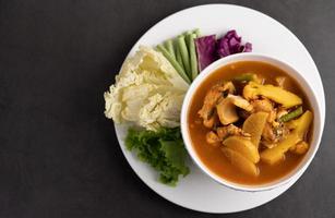 Yellow curry with snakehead fish photo