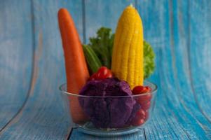 Fresh tomatoes, carrots, cucumbers, onions and cabbage photo