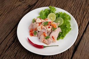Spicy lime pork with salad photo