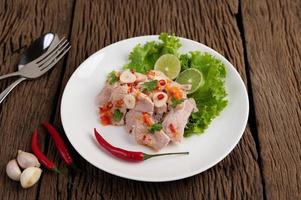 Spicy lime pork with salad photo