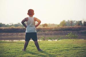 Super boy stands to show super powers photo