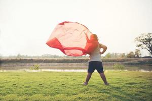 Super boy stands to show super powers photo