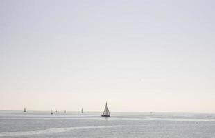 sailboat sailing in the sea in a clear day photo