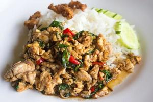 Stir fried pork and basil with rice photo