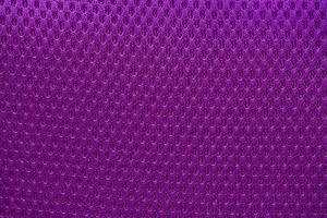 Violet nylon fabric textured background with hexagonal shape photo