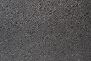 Grey background from a textile material with wicker pattern, closeup. photo