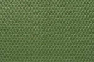 Green nylon fabric textured background with hexagonal shape photo