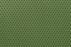 Green nylon fabric textured background with hexagonal shape photo