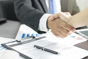 Two businessmen shaking hands photo