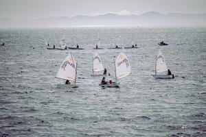 Spain, 2020 - People riding on sail boat on sea during daytime photo