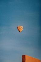 Orange hot air balloon on sky photo