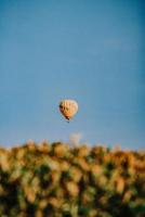 Hot air balloon in mid air under blue sky during daytime photo