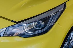 Yellow car headlights photo