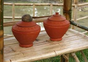 Water jars on the bamboo table photo